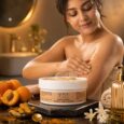 Person using Scrub Naturals Brightening Apricot Body Scrub during a shower for gentle exfoliation and glowing skin.